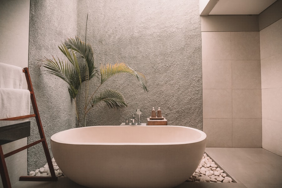 Serene spa-style bath area with towels and soft neutral tones evoking restorative treatment spaces.